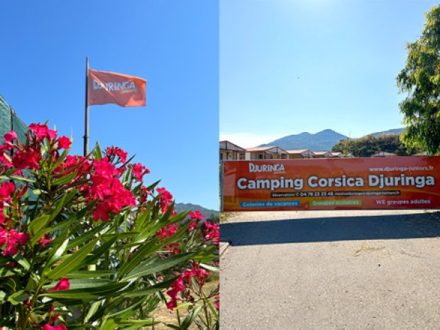 drapeau et bâche qui indiquent l'emplacement du camping et le logement Corsica Djuringa